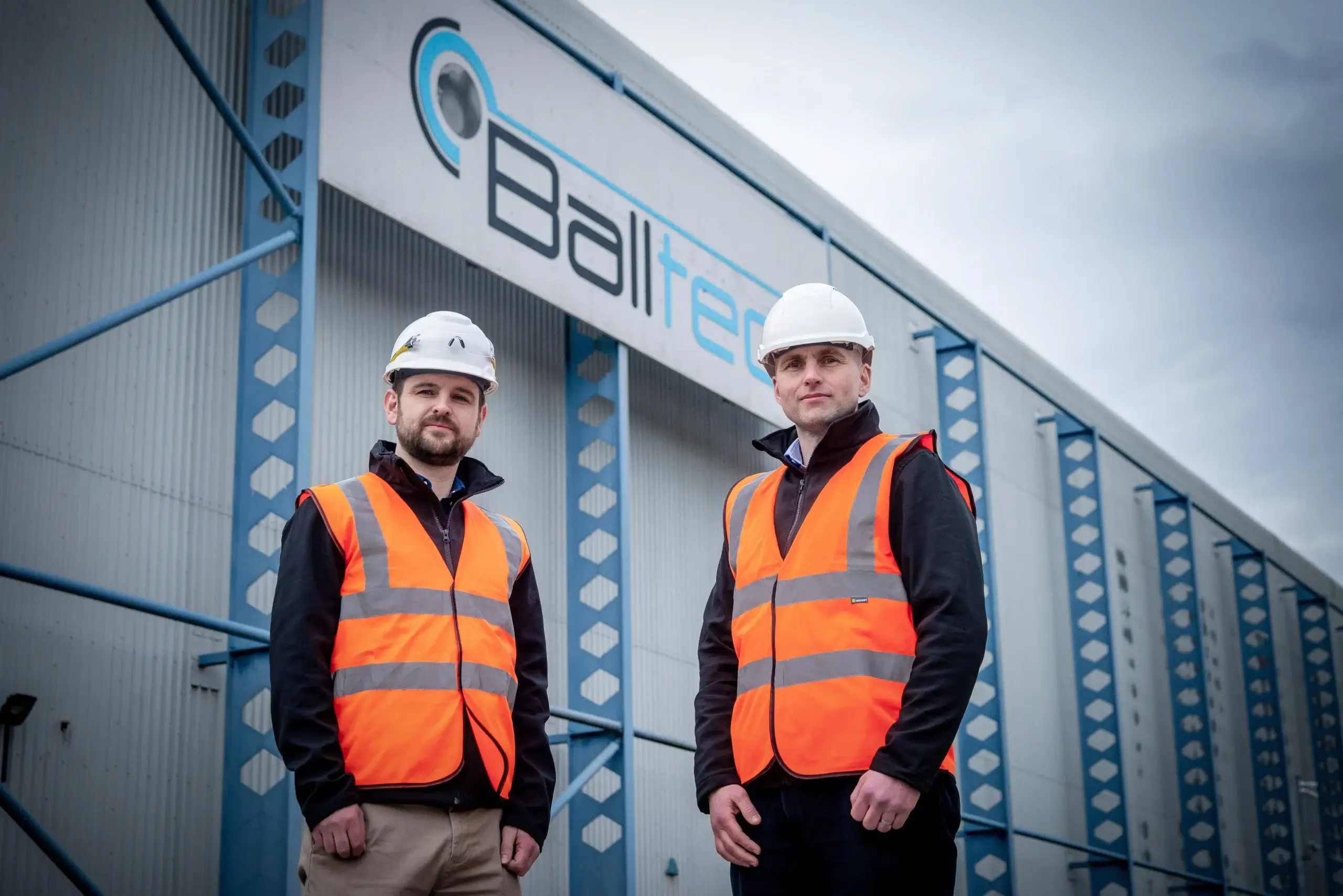 Two employees outside Balltec building